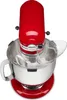 A red KitchenAid stand mixer with a clear splash guard and a beater inside a stainless steel bowl, viewed from a top-down angle. Voir les images du produit
