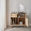 A wooden record cabinet with a turntable and records on top, placed near a window with sheer curtains. Anteprima dell’immagine prodotto