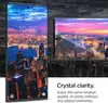 A smartphone screen displaying a city skyline at dusk, with a smaller inset image of the same scene. Text below describes the product's clarity. Podgląd zdjęcia produktu