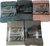 A collage of five packaged blankets in different colors. Produktbild-Vorschau