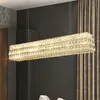 A rectangular crystal chandelier hangs above a dining table. Náhľad obrázku produktu