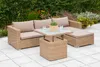 An outdoor patio setting with a wicker lounge set and a coffee table. Produktbild-Vorschau