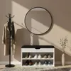 An entryway scene with a shoe cabinet, coat rack, and mirror. Produktbild-Vorschau