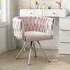 A pink velvet chair in front of a white vanity. Produktbild-Vorschau