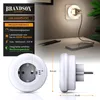 A product image showing a night light plugged into a wall socket, with a phone charging nearby. Voir les images du produit