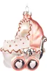 A close-up studio shot of a glass Christmas ornament shaped like a baby carriage. Podgląd zdjęcia produktu