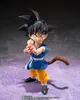 A Dragon Ball GT S.H. Figuarts Actionfigur Trunks figure is posed against a dark, textured background with a purple, speckled ground. Voir les images du produit