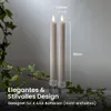 Two LED candles with flames are shown in a decorative setting with ivy. Produktbild-Vorschau