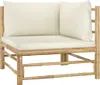 A corner section of a bamboo outdoor lounge set with cream-colored cushions, presented against a white background. Produktbild-Vorschau