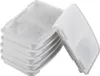 A stack of white pet water filter replacements and one filter detached from the stack. Voir les images du produit