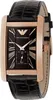 A close-up studio shot of a rectangular watch with a black dial and rose gold casing. Voir les images du produit