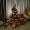 A decorated Christmas tree with presents underneath, a rocking horse with a gnome, and a chair in the background. Náhled obrázku produktu