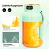 A portable blender with juice inside, showing two modes: mixing and self-cleaning, with accompanying diagrams. Produktbild-Vorschau