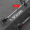 Close-up view of a grass trimmer's adjustable handle and cutting head, with measurement markings and instructional text. Produktbild-Vorschau