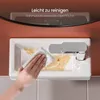 A hand is cleaning a white sink with a wipe, showing its easy-to-clean surface. Voir les images du produit