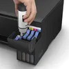 A hand is shown refilling the ink tank of an Epson EcoTank printer. Podgląd zdjęcia produktu