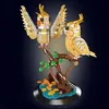 A model of two cockatiels perched on a tree branch, made from building blocks. Náhľad obrázku produktu