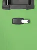 A close-up view of a green suitcase with a black luggage tag. Anteprima dell’immagine prodotto