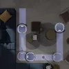 A top-down view of a living room with multiple robot vacuums cleaning the floor. Náhled obrázku produktu