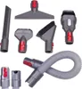 A collection of vacuum cleaner attachments and a hose are laid out on a white background. Voir les images du produit