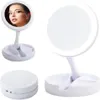 A collage of images showing a white LED makeup mirror from different angles, including a close-up of a woman using it. Náhľad obrázku produktu