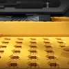 A close-up view of a precision screwdriver set with multiple bits organized in a yellow case. Voir les images du produit