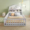 A child's bed with a house-shaped headboard and built-in shelves, decorated with toys and pillows, in a room with light green walls. Náhľad obrázku produktu