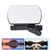 A product shot of a clip-on mirror for a smartphone camera, with two landscape photos below. Voir les images du produit