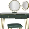 A dark green vanity table with gold legs and a matching stool, shown with two illuminated mirrors. Náhľad obrázku produktu
