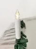 A close-up of a white LED candle light with a green clip, part of a string of lights. Produktbild-Vorschau
