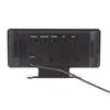 The back view of a black digital clock with buttons and a power port. Produktbild-Vorschau
