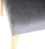 A close-up view of a chair's seat and leg. Voir les images du produit