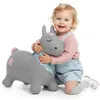 A young child hugging a gray inflatable pony toy. Anteprima dell’immagine prodotto