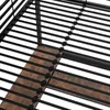 Close-up view of a bed frame with black metal slats and wooden planks. Podgląd zdjęcia produktu