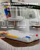 A person's hand is shown interacting with a keyboard, with icons and text indicating connection modes and compatible devices. Produktbild-Vorschau