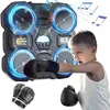 A child is shown punching a boxing machine with lights and music. Produktbild-Vorschau