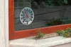 A thermometer is attached to a windowpane, showing the temperature. Anteprima dell’immagine prodotto