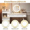 A vanity table with a lighted mirror and makeup products, showing different light settings. Produktbild-Vorschau