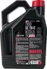 A black plastic bottle of MOTUL 7100 4T Motor Oil with a red cap, shown against a white background. Podgląd zdjęcia produktu