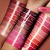 Swatches of different lipstick shades on arms, with a lipstick tube in the upper right corner. Produktbild-Vorschau