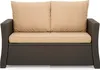 A close-up front view of a brown rattan sofa with beige cushions. Produktbild-Vorschau