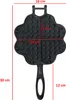 A black cast iron waffle maker shaped like a clover or heart, with dimensions indicated by red lines and text. Produktbild-Vorschau
