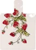 A ceramic cutting board with a strawberry pattern. Produktbild-Vorschau