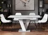 A dining room setting with a table and chairs. Voir les images du produit