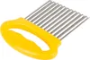 A close-up shot of a yellow and silver wavy-edged cutter. Podgląd zdjęcia produktu