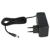 A black power adapter with a coiled black cable and a circular connector. Produktbild-Vorschau