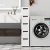 A narrow cabinet with drawers is placed next to a washing machine in a bathroom. Podgląd zdjęcia produktu