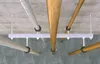 Pipes and wooden beams suspended from a concrete ceiling by metal brackets. Anteprima dell’immagine prodotto