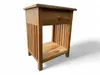 A wooden nightstand with a drawer and a shelf, presented against a white background. Náhľad obrázku produktu