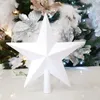 A white glitter star tree topper is shown in front of a decorated Christmas tree. Anteprima dell’immagine prodotto